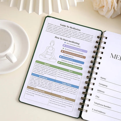 Meditation guide book open on a table with a cup and flowers in the background, for mindfulness meditation and mental health